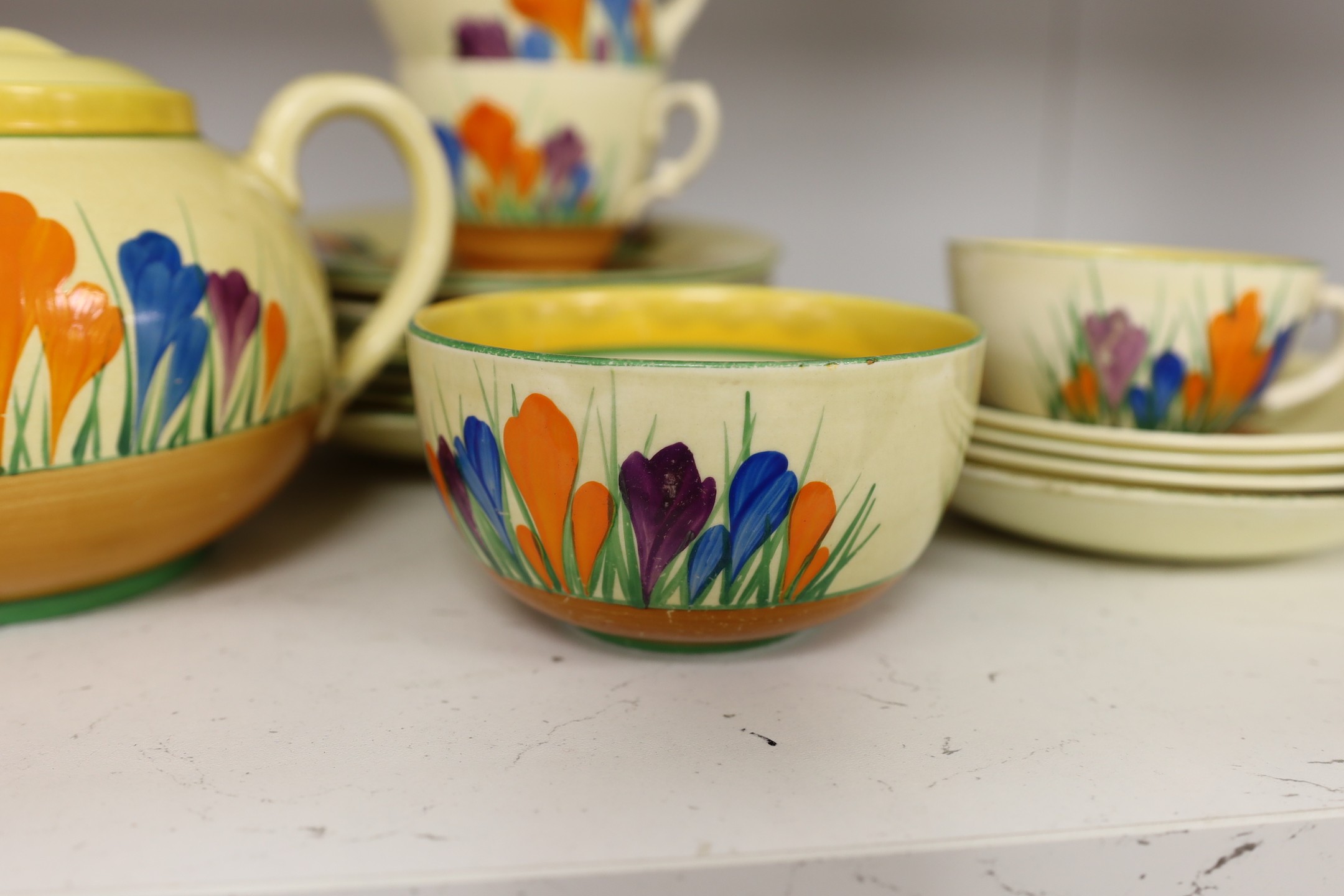 A group of Clarice Cliff crocus pattern tea wares, teapot 22 cm across